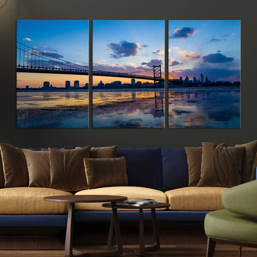 A photograph titled "Large Wall Art Philadelphia Canvas Print - Benjamin Franklin Bridge at Sunset" displays a breathtaking cityscape of the bridge reflected in the water. This image features a gallery-quality finish that promises to transform any space into an evocative memory.