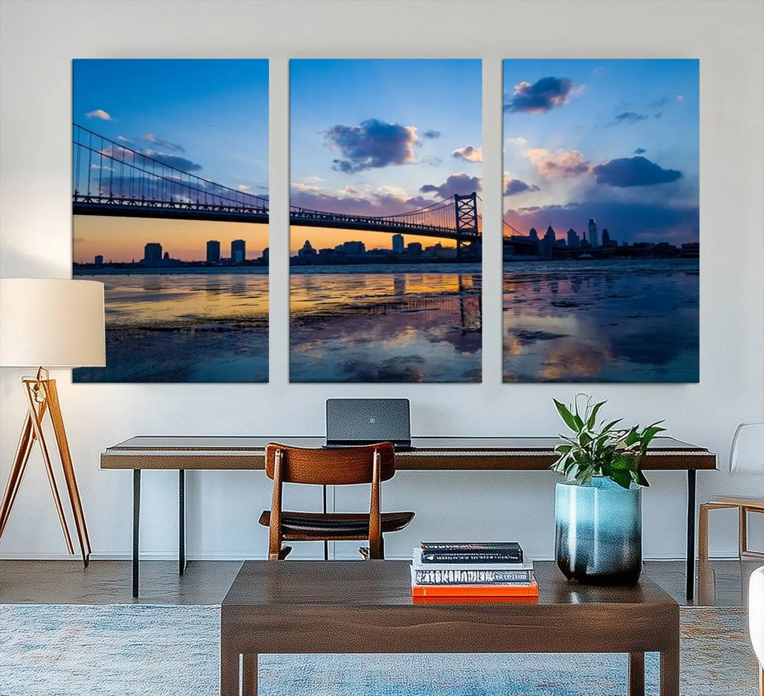 A photograph titled "Large Wall Art Philadelphia Canvas Print - Benjamin Franklin Bridge at Sunset" displays a breathtaking cityscape of the bridge reflected in the water. This image features a gallery-quality finish that promises to transform any space into an evocative memory.