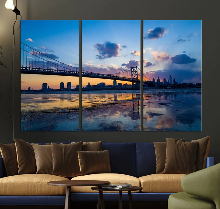 A photograph titled "Large Wall Art Philadelphia Canvas Print - Benjamin Franklin Bridge at Sunset" displays a breathtaking cityscape of the bridge reflected in the water. This image features a gallery-quality finish that promises to transform any space into an evocative memory.