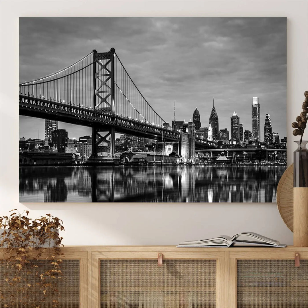 The "Large Wall Art Philadelphia Canvas Print" showcases a black-and-white depiction of the Ben Franklin Bridge with a water reflection.