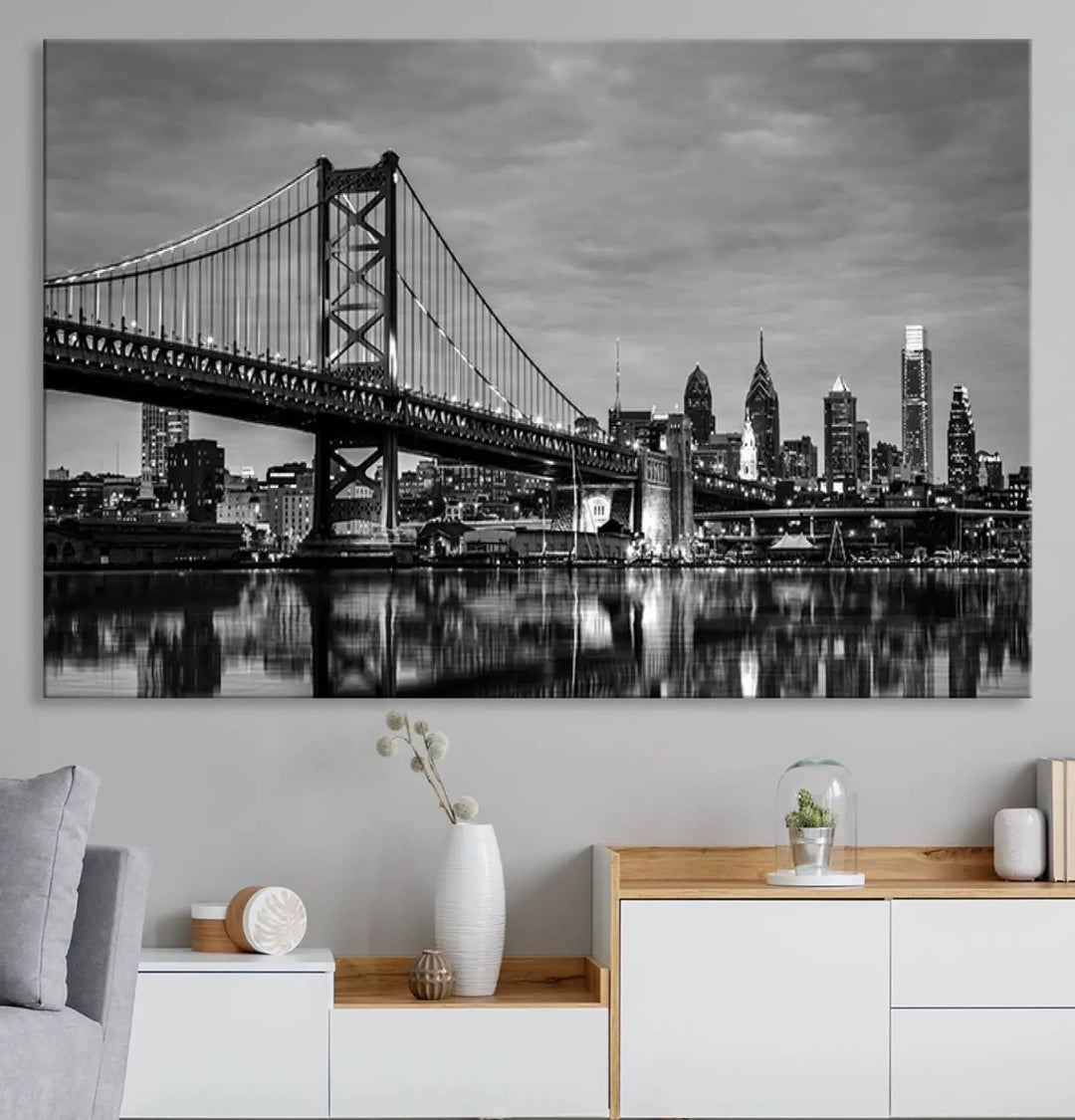 The "Large Wall Art Philadelphia Canvas Print" showcases a black-and-white depiction of the Ben Franklin Bridge with a water reflection.