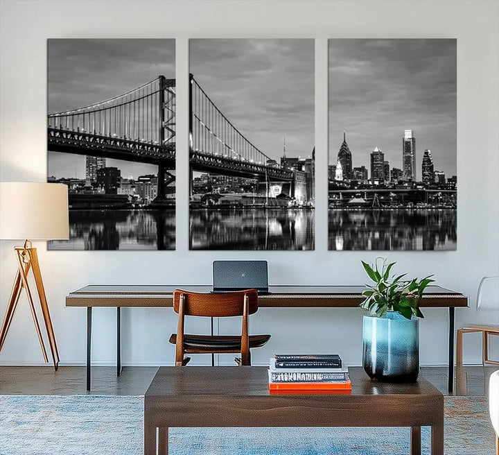 The "Large Wall Art Philadelphia Canvas Print" showcases a black-and-white depiction of the Ben Franklin Bridge with a water reflection.