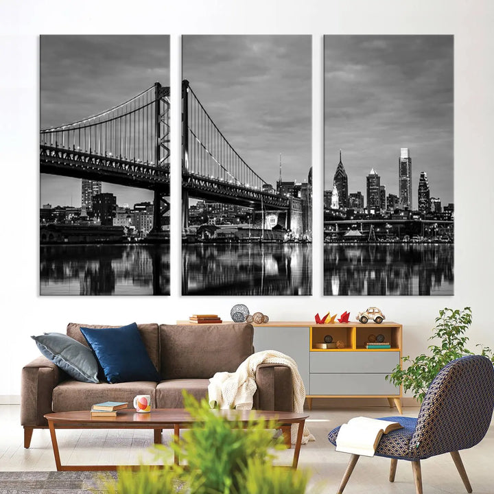 The "Large Wall Art Philadelphia Canvas Print" showcases a black-and-white depiction of the Ben Franklin Bridge with a water reflection.