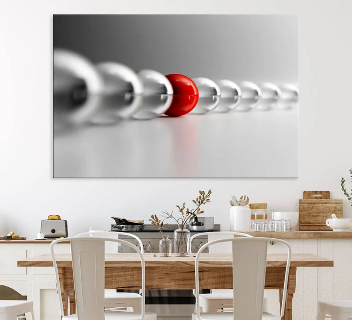 Displayed in a dining room, the Red Ball in Gray Balls canvas boasts a gallery-quality finish.