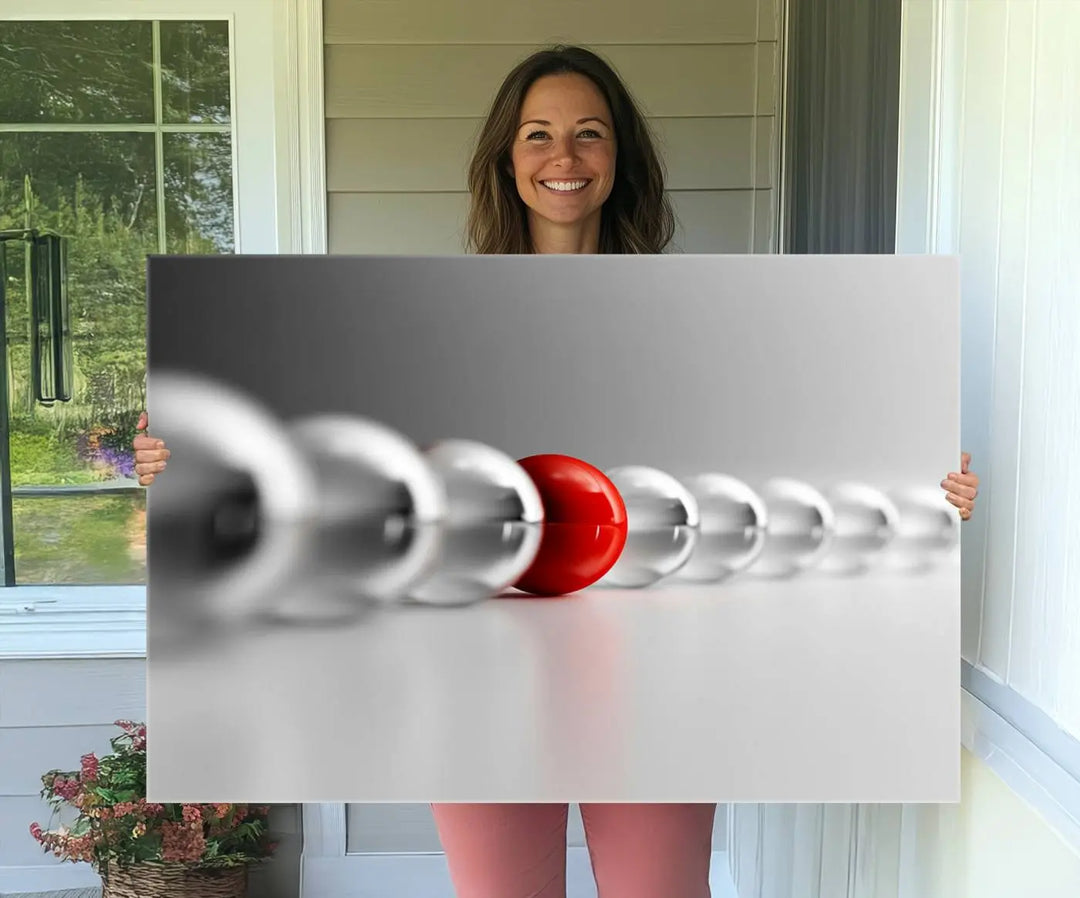 Displayed in a dining room, the Red Ball in Gray Balls canvas boasts a gallery-quality finish.