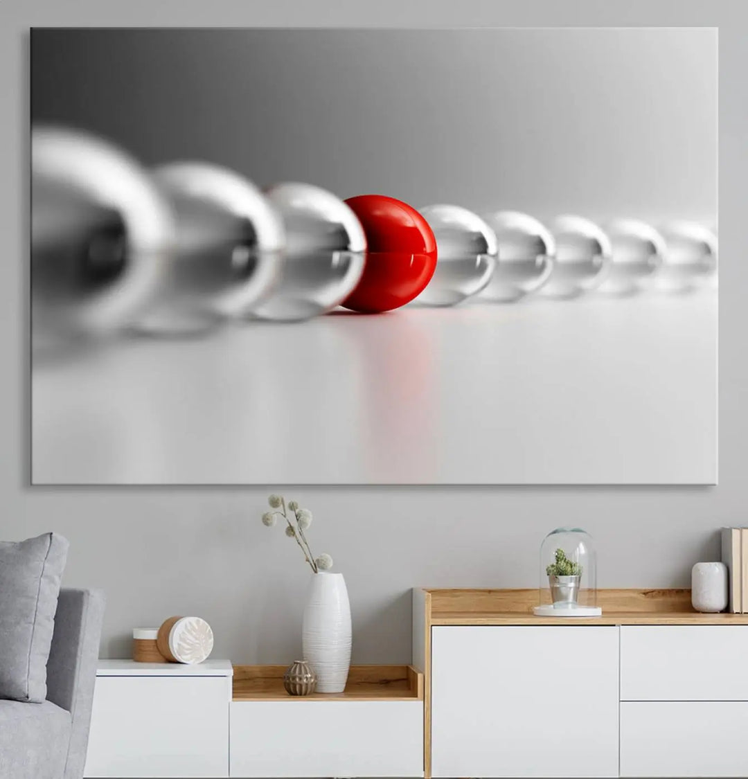 Displayed in a dining room, the Red Ball in Gray Balls canvas boasts a gallery-quality finish.