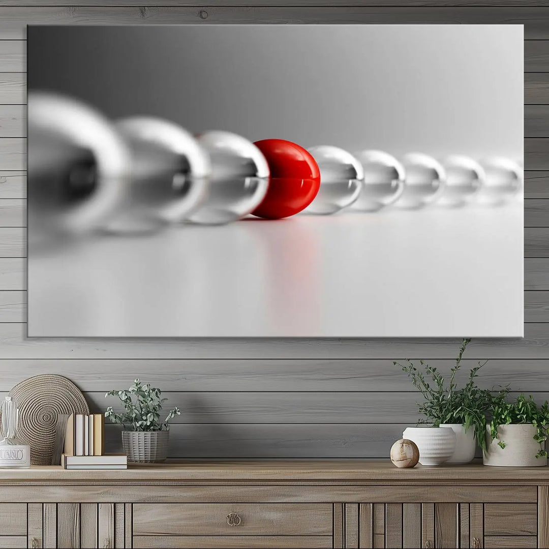 Displayed in a dining room, the Red Ball in Gray Balls canvas boasts a gallery-quality finish.