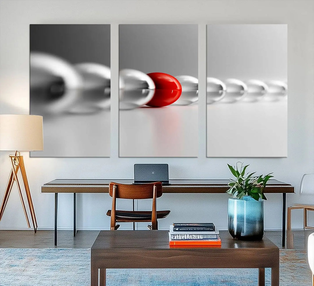 Displayed in a dining room, the Red Ball in Gray Balls canvas boasts a gallery-quality finish.