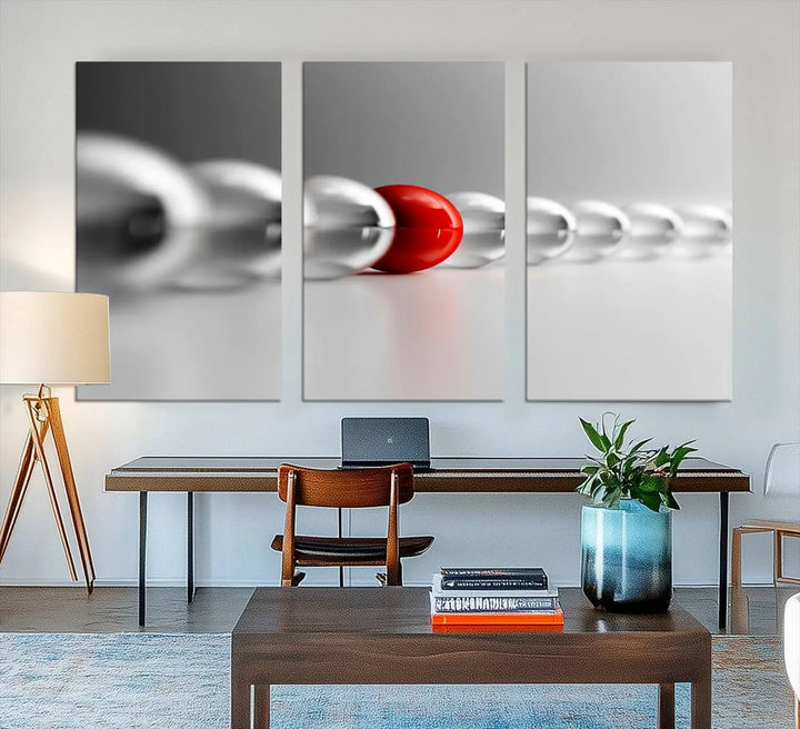 Displayed in a dining room, the Red Ball in Gray Balls canvas boasts a gallery-quality finish.