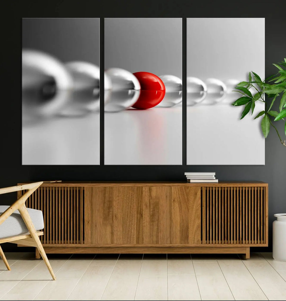 Displayed in a dining room, the Red Ball in Gray Balls canvas boasts a gallery-quality finish.