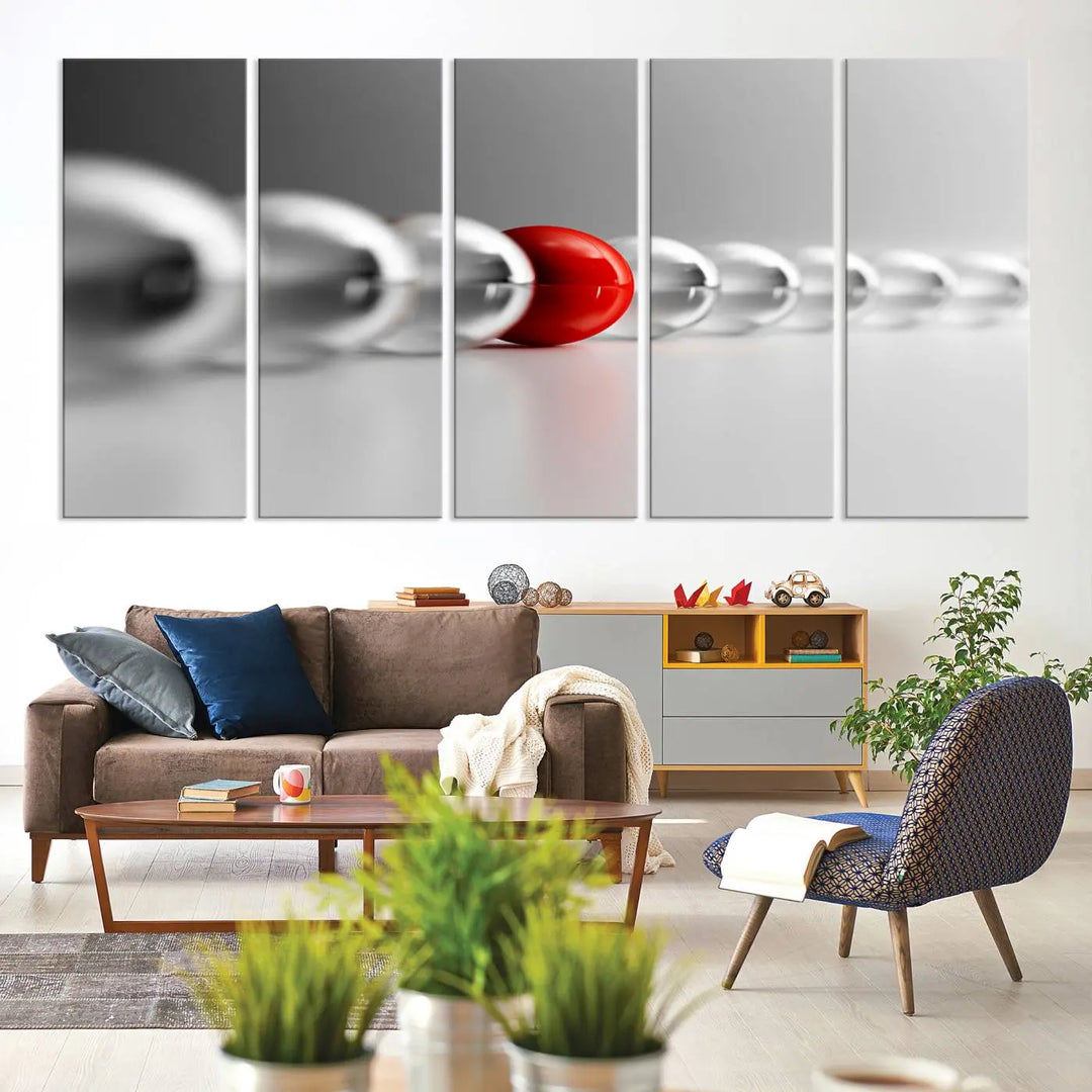 Displayed in a dining room, the Red Ball in Gray Balls canvas boasts a gallery-quality finish.