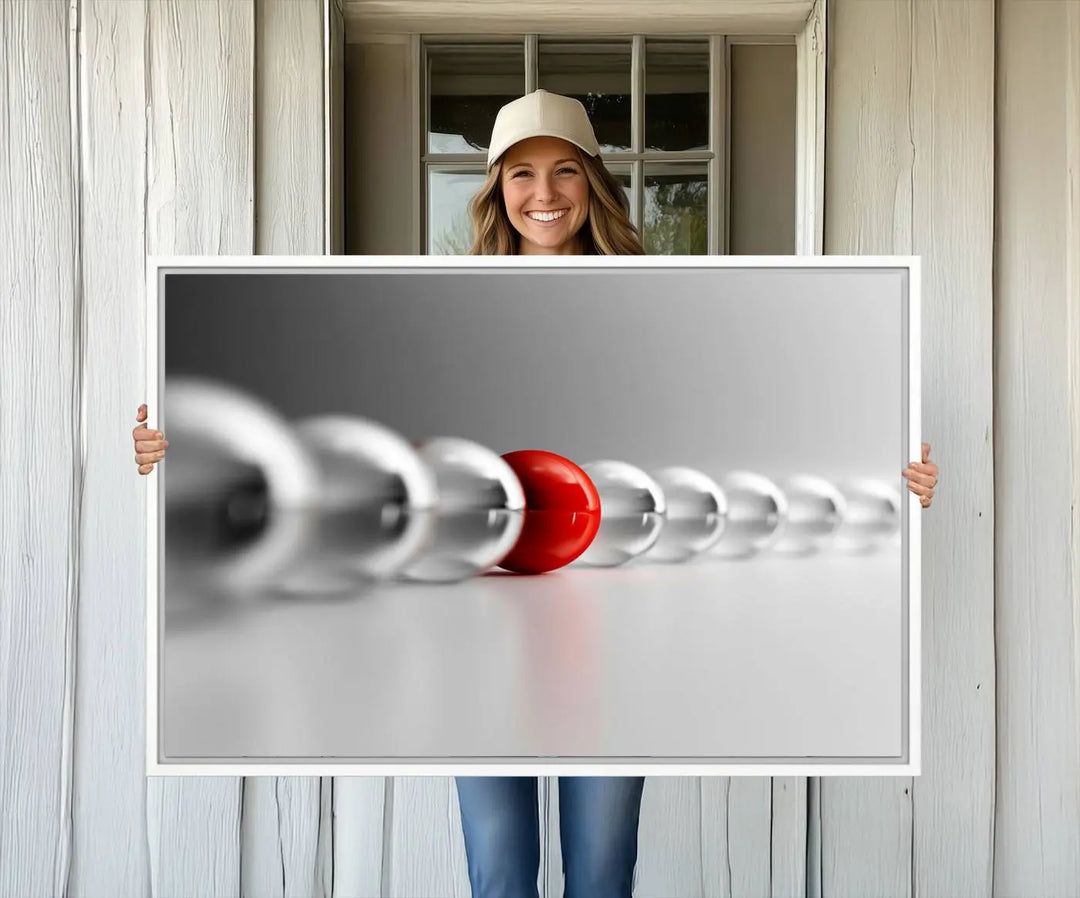 Displayed in a dining room, the Red Ball in Gray Balls canvas boasts a gallery-quality finish.