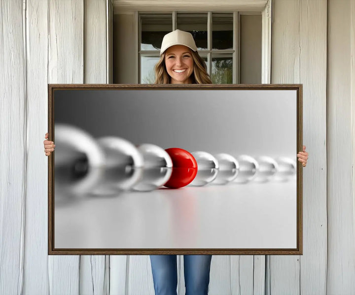 Displayed in a dining room, the Red Ball in Gray Balls canvas boasts a gallery-quality finish.