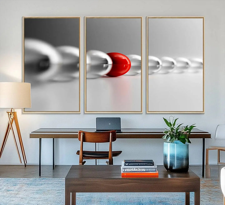 Displayed in a dining room, the Red Ball in Gray Balls canvas boasts a gallery-quality finish.