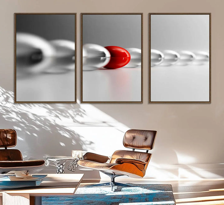 Displayed in a dining room, the Red Ball in Gray Balls canvas boasts a gallery-quality finish.