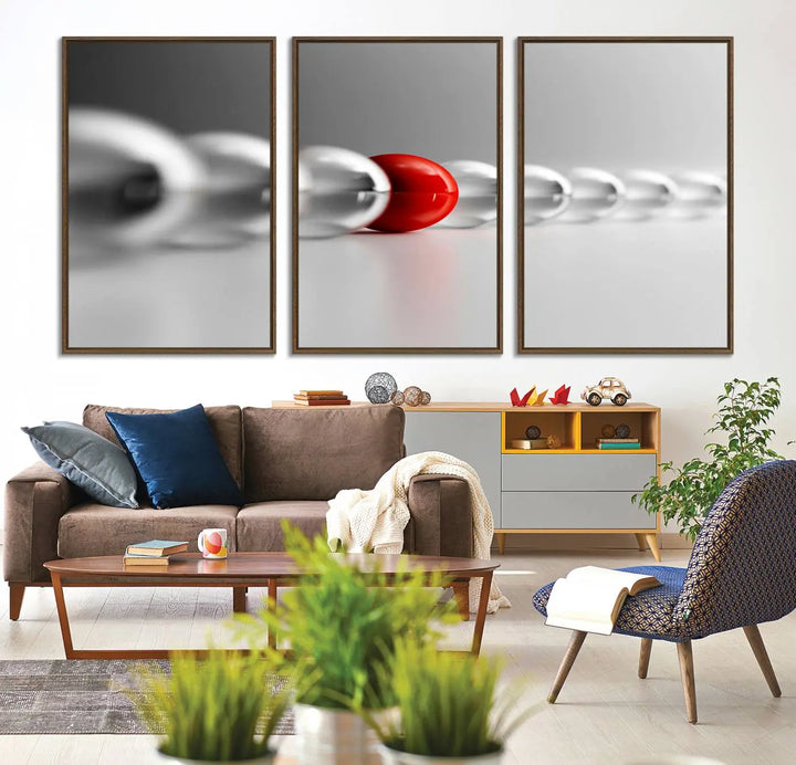 Displayed in a dining room, the Red Ball in Gray Balls canvas boasts a gallery-quality finish.