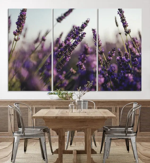 Displayed on the wall is a triptych of the Lavender Wall Art Floral Canvas Print, crafted with museum-quality materials and a UV-protective coating to maintain its vibrant elegance over time.