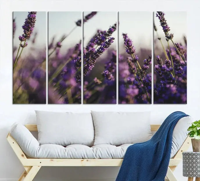 Displayed on the wall is a triptych of the Lavender Wall Art Floral Canvas Print, crafted with museum-quality materials and a UV-protective coating to maintain its vibrant elegance over time.