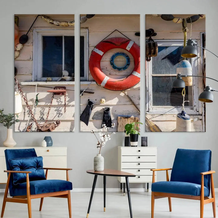 The living room features the Lifebuoy Wall Art Nautical Canvas Print, a museum-quality piece that showcases a lifebuoy alongside fishing gear. The artwork is ready to hang and includes a UV-protective coating to ensure lasting vibrancy.