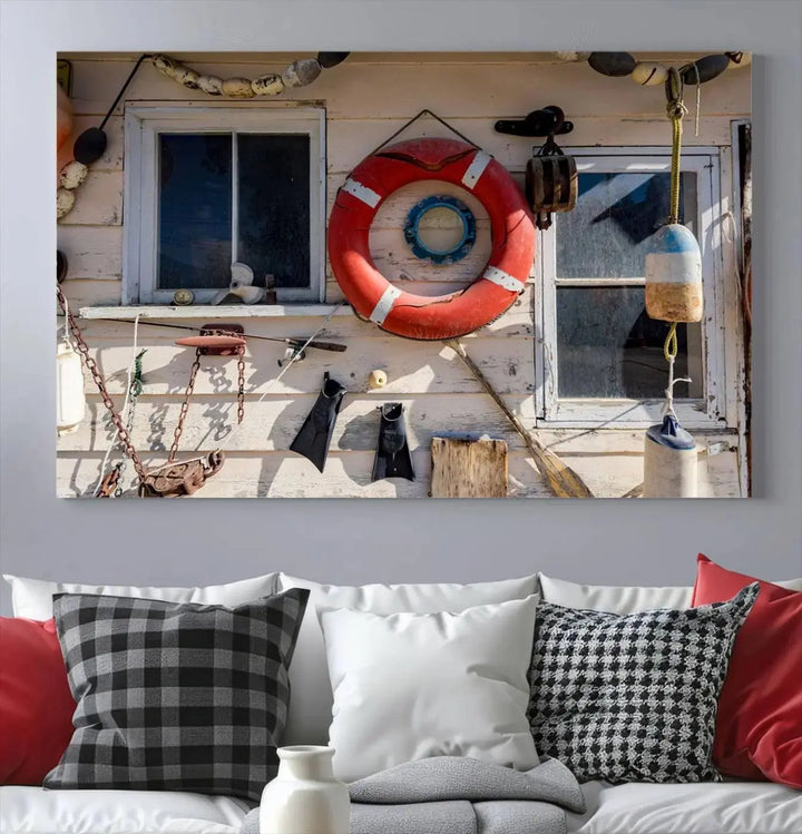 The living room features the Lifebuoy Wall Art Nautical Canvas Print, a museum-quality piece that showcases a lifebuoy alongside fishing gear. The artwork is ready to hang and includes a UV-protective coating to ensure lasting vibrancy.