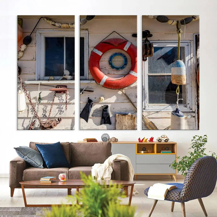 The living room features the Lifebuoy Wall Art Nautical Canvas Print, a museum-quality piece that showcases a lifebuoy alongside fishing gear. The artwork is ready to hang and includes a UV-protective coating to ensure lasting vibrancy.