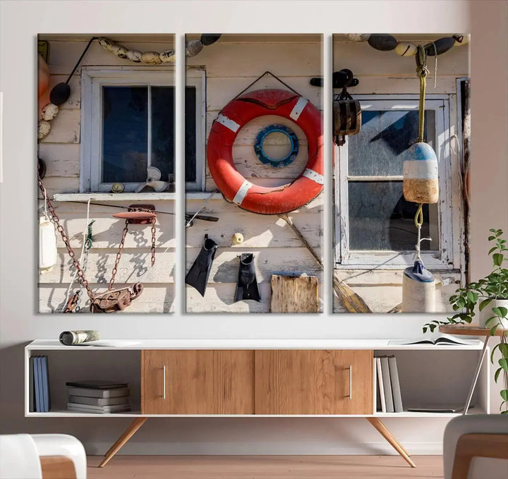 The living room features the Lifebuoy Wall Art Nautical Canvas Print, a museum-quality piece that showcases a lifebuoy alongside fishing gear. The artwork is ready to hang and includes a UV-protective coating to ensure lasting vibrancy.