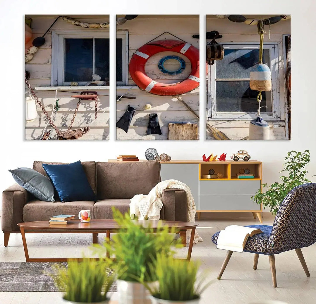 The living room features the Lifebuoy Wall Art Nautical Canvas Print, a museum-quality piece that showcases a lifebuoy alongside fishing gear. The artwork is ready to hang and includes a UV-protective coating to ensure lasting vibrancy.