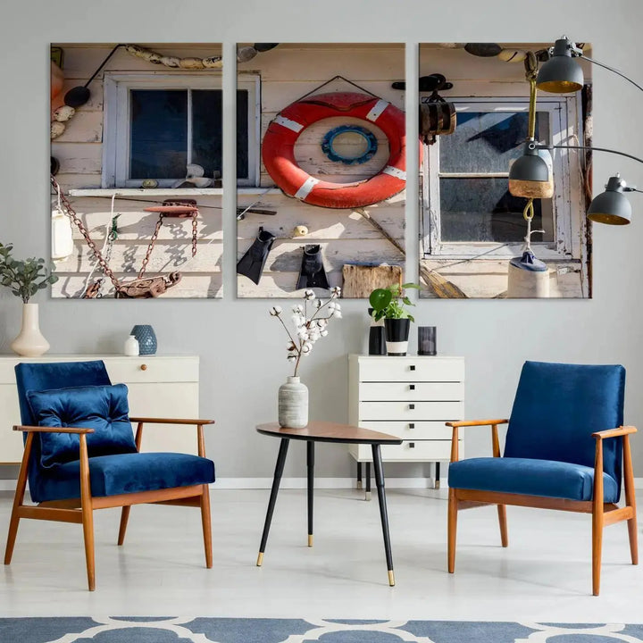 The living room features the Lifebuoy Wall Art Nautical Canvas Print, a museum-quality piece that showcases a lifebuoy alongside fishing gear. The artwork is ready to hang and includes a UV-protective coating to ensure lasting vibrancy.