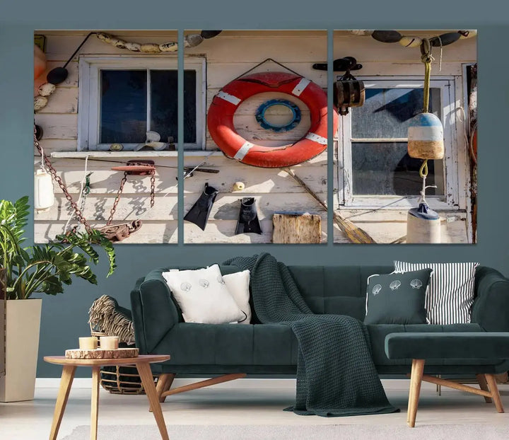 The living room features the Lifebuoy Wall Art Nautical Canvas Print, a museum-quality piece that showcases a lifebuoy alongside fishing gear. The artwork is ready to hang and includes a UV-protective coating to ensure lasting vibrancy.