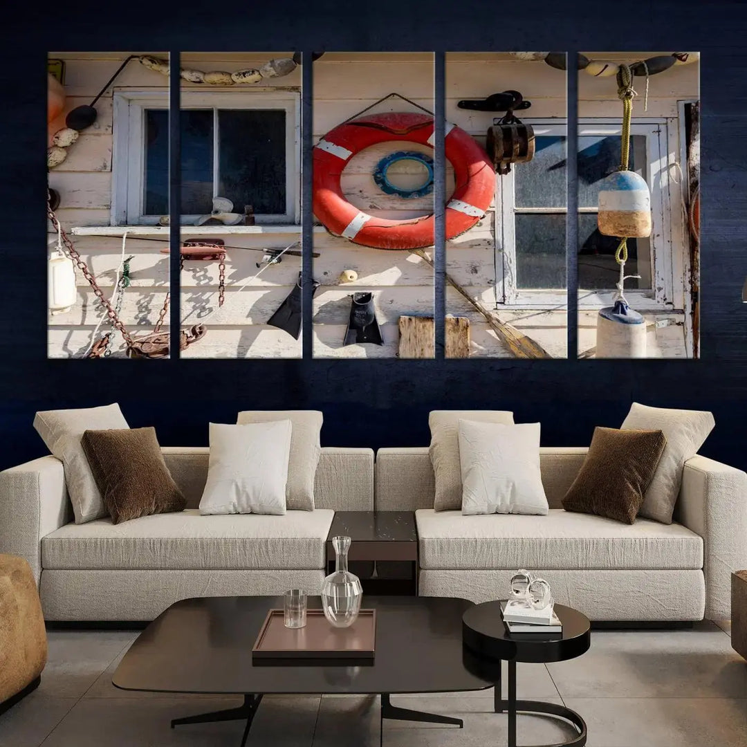 The living room features the Lifebuoy Wall Art Nautical Canvas Print, a museum-quality piece that showcases a lifebuoy alongside fishing gear. The artwork is ready to hang and includes a UV-protective coating to ensure lasting vibrancy.