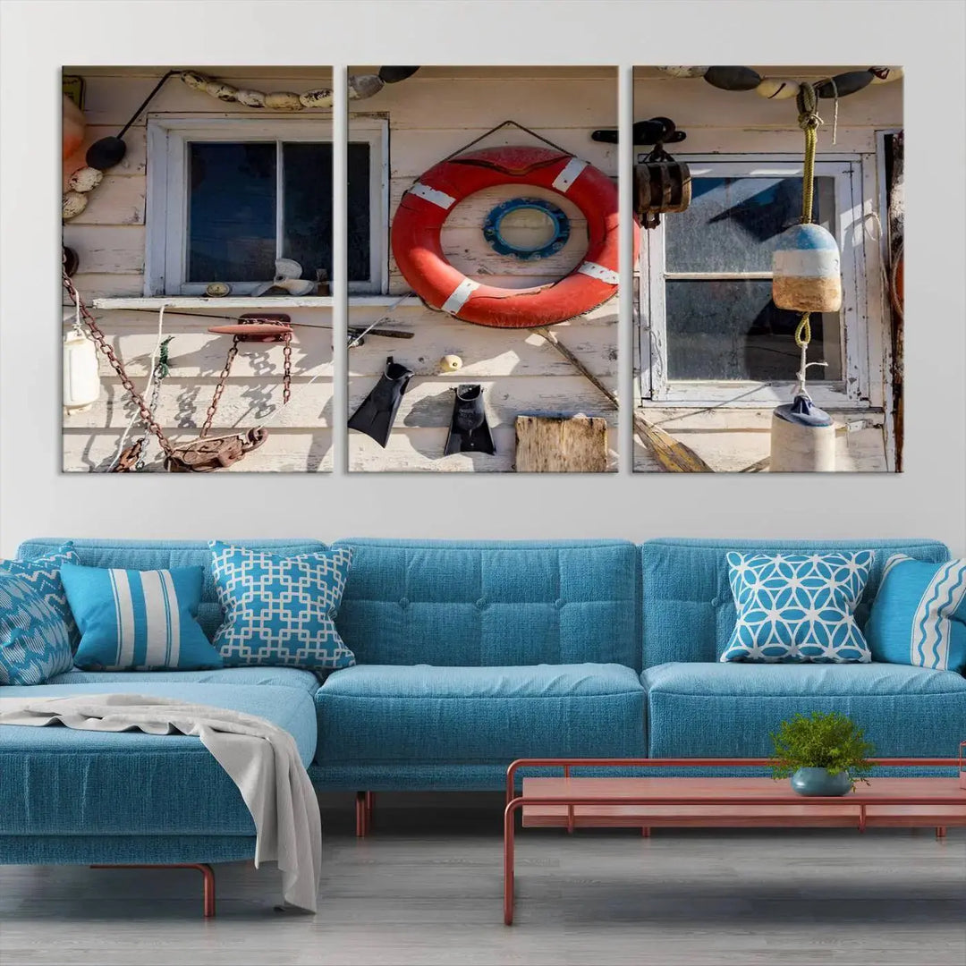 The living room features the Lifebuoy Wall Art Nautical Canvas Print, a museum-quality piece that showcases a lifebuoy alongside fishing gear. The artwork is ready to hang and includes a UV-protective coating to ensure lasting vibrancy.