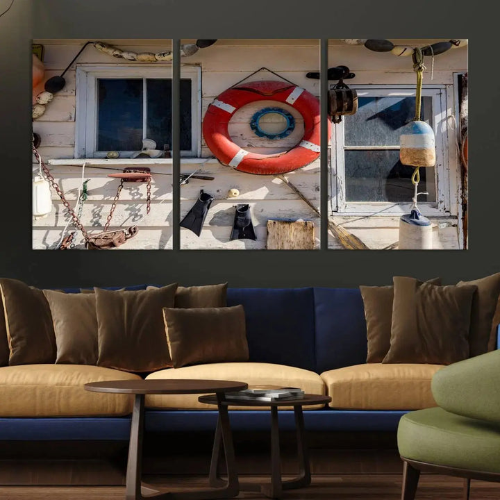 The living room features the Lifebuoy Wall Art Nautical Canvas Print, a museum-quality piece that showcases a lifebuoy alongside fishing gear. The artwork is ready to hang and includes a UV-protective coating to ensure lasting vibrancy.