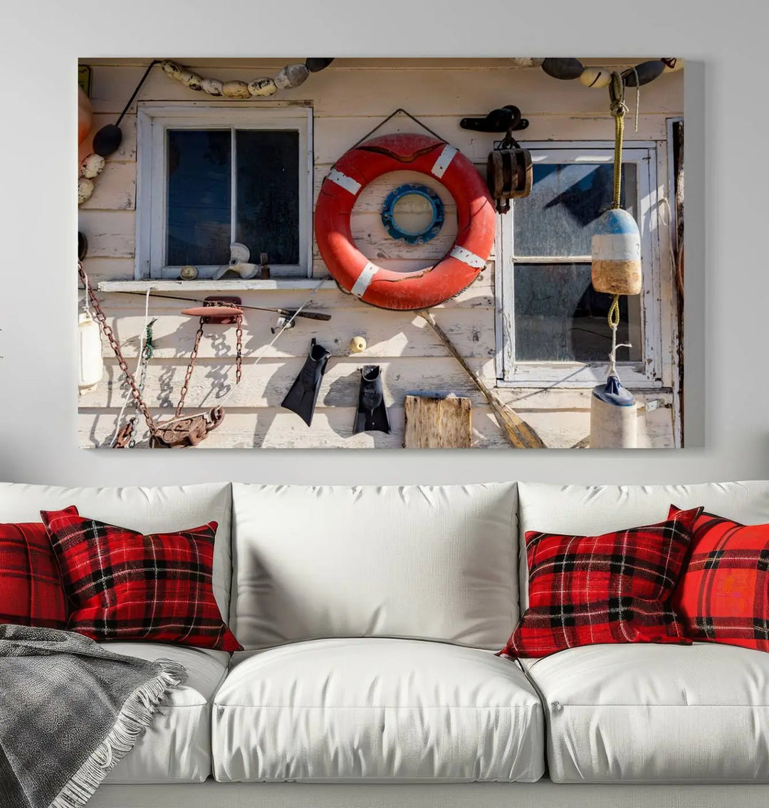 The living room features the Lifebuoy Wall Art Nautical Canvas Print, a museum-quality piece that showcases a lifebuoy alongside fishing gear. The artwork is ready to hang and includes a UV-protective coating to ensure lasting vibrancy.