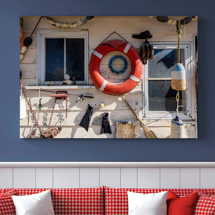 The living room features the Lifebuoy Wall Art Nautical Canvas Print, a museum-quality piece that showcases a lifebuoy alongside fishing gear. The artwork is ready to hang and includes a UV-protective coating to ensure lasting vibrancy.