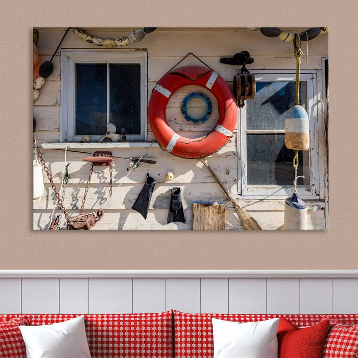 The living room features the Lifebuoy Wall Art Nautical Canvas Print, a museum-quality piece that showcases a lifebuoy alongside fishing gear. The artwork is ready to hang and includes a UV-protective coating to ensure lasting vibrancy.