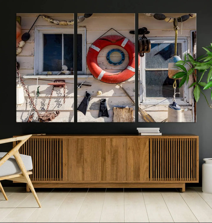 The living room features the Lifebuoy Wall Art Nautical Canvas Print, a museum-quality piece that showcases a lifebuoy alongside fishing gear. The artwork is ready to hang and includes a UV-protective coating to ensure lasting vibrancy.