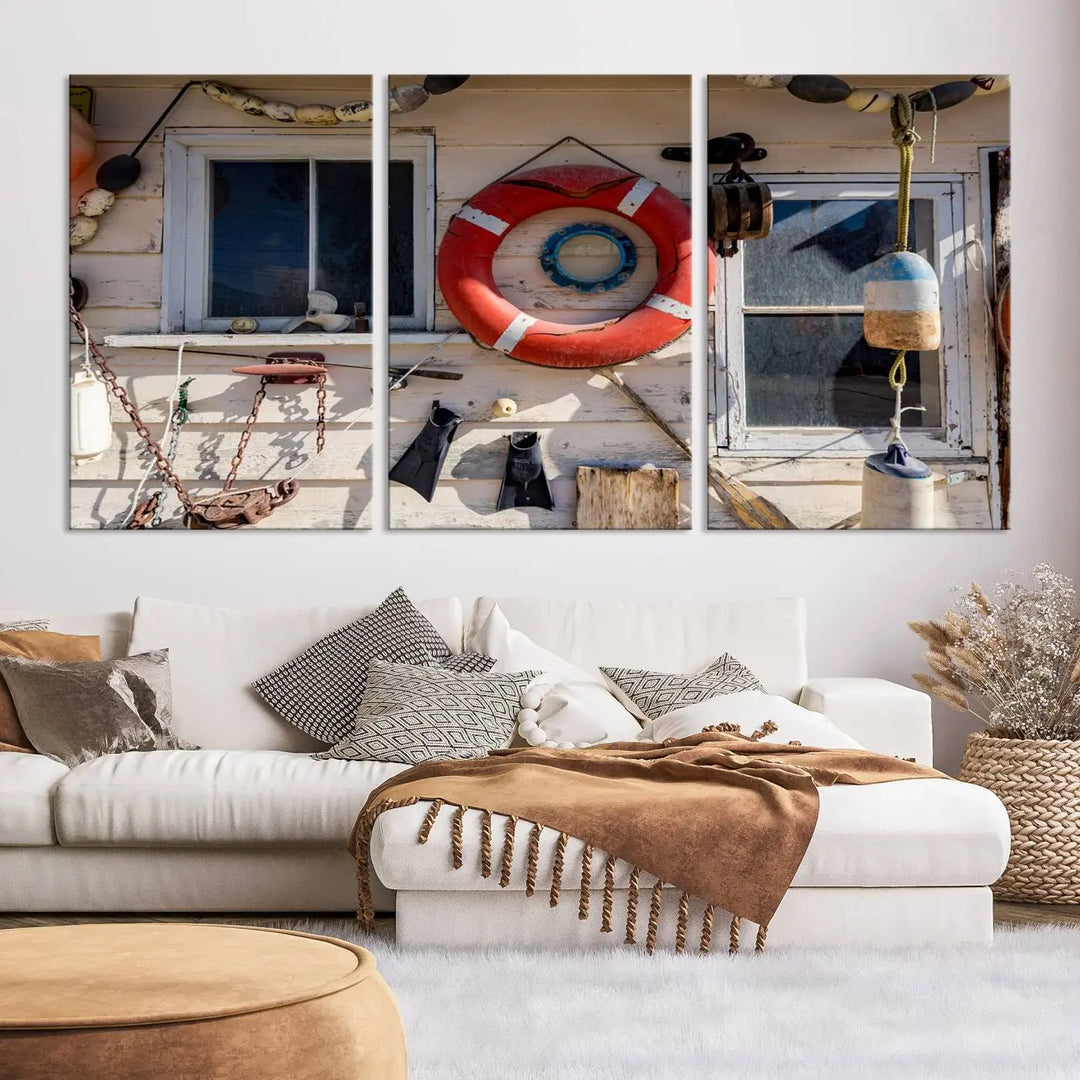 The living room features the Lifebuoy Wall Art Nautical Canvas Print, a museum-quality piece that showcases a lifebuoy alongside fishing gear. The artwork is ready to hang and includes a UV-protective coating to ensure lasting vibrancy.