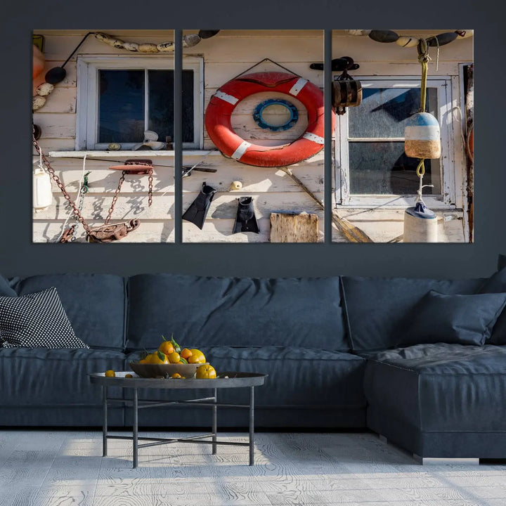 The living room features the Lifebuoy Wall Art Nautical Canvas Print, a museum-quality piece that showcases a lifebuoy alongside fishing gear. The artwork is ready to hang and includes a UV-protective coating to ensure lasting vibrancy.