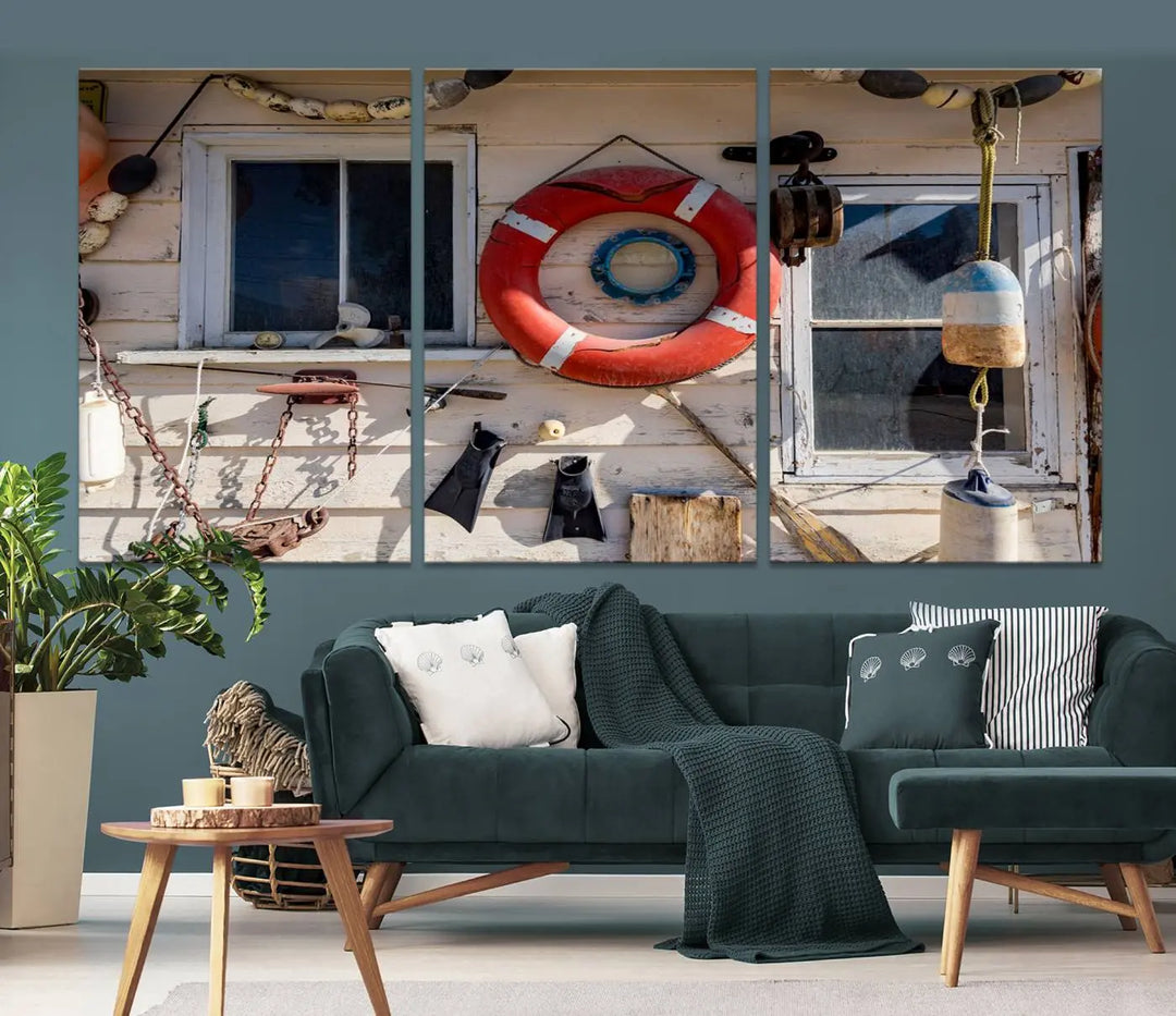 The living room features the Lifebuoy Wall Art Nautical Canvas Print, a museum-quality piece that showcases a lifebuoy alongside fishing gear. The artwork is ready to hang and includes a UV-protective coating to ensure lasting vibrancy.