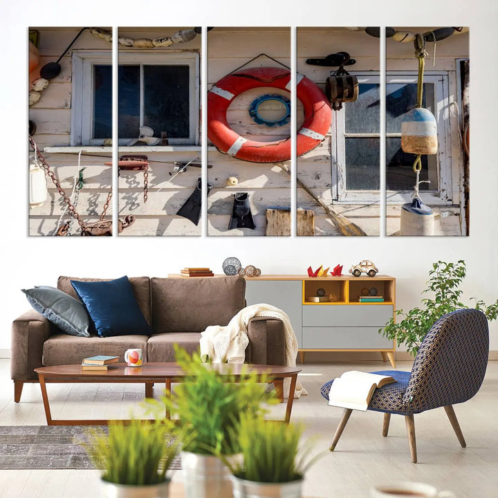 The living room features the Lifebuoy Wall Art Nautical Canvas Print, a museum-quality piece that showcases a lifebuoy alongside fishing gear. The artwork is ready to hang and includes a UV-protective coating to ensure lasting vibrancy.