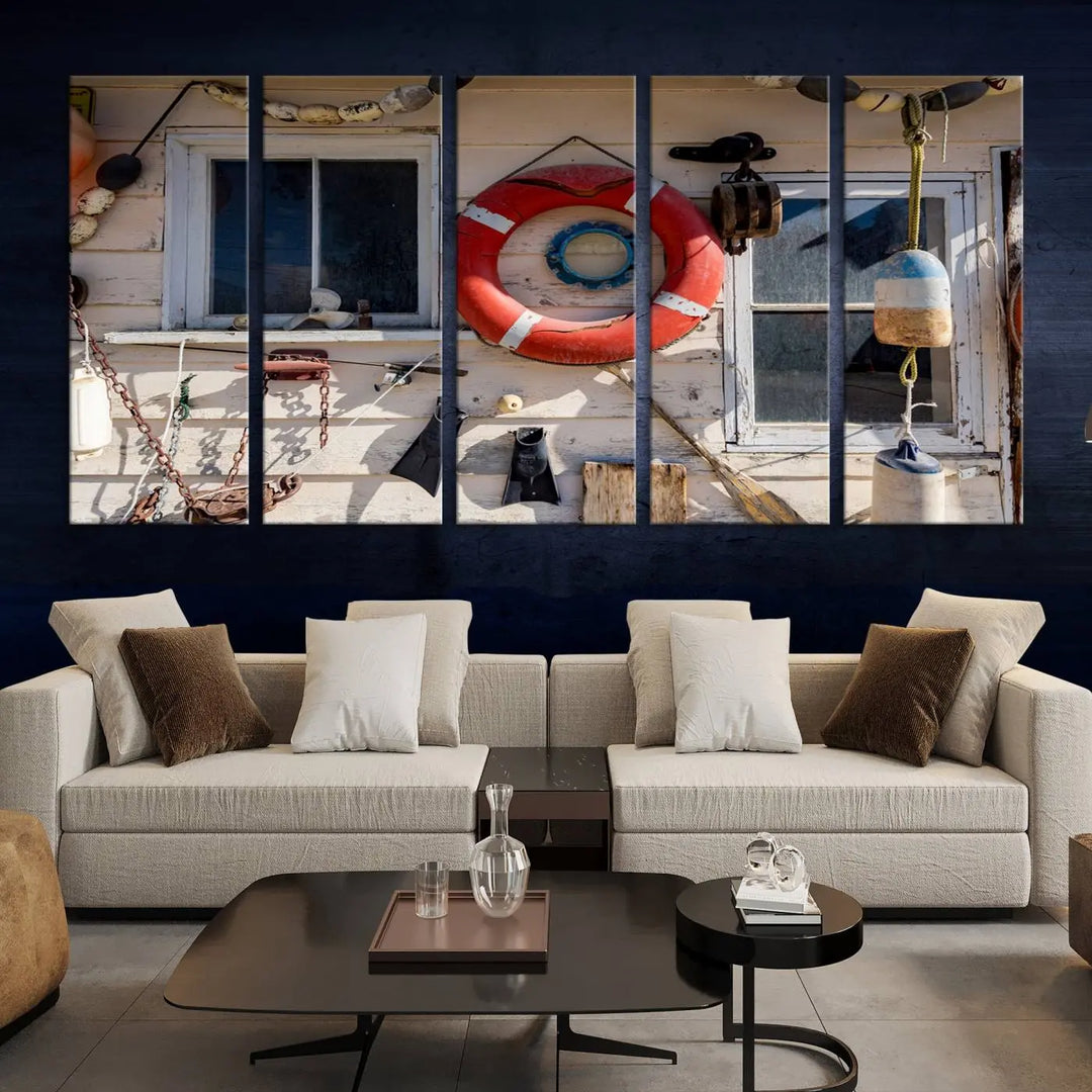 The living room features the Lifebuoy Wall Art Nautical Canvas Print, a museum-quality piece that showcases a lifebuoy alongside fishing gear. The artwork is ready to hang and includes a UV-protective coating to ensure lasting vibrancy.