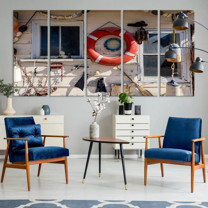 The living room features the Lifebuoy Wall Art Nautical Canvas Print, a museum-quality piece that showcases a lifebuoy alongside fishing gear. The artwork is ready to hang and includes a UV-protective coating to ensure lasting vibrancy.