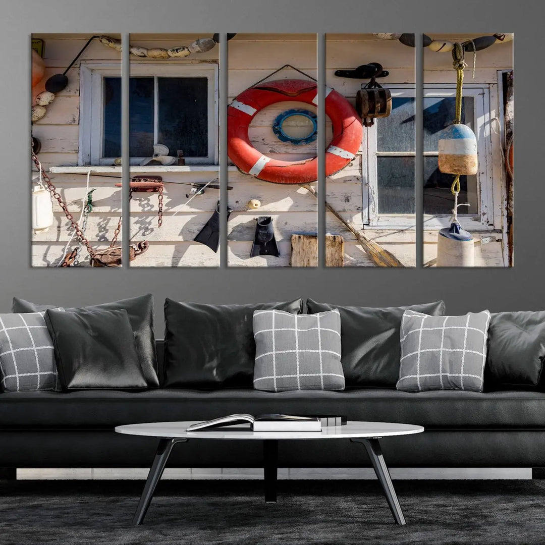 The living room features the Lifebuoy Wall Art Nautical Canvas Print, a museum-quality piece that showcases a lifebuoy alongside fishing gear. The artwork is ready to hang and includes a UV-protective coating to ensure lasting vibrancy.