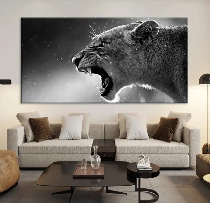 A Lion Wall Art Canvas Print depicting a roaring lioness in black and white, expertly gallery wrapped with UV-protective coating, is displayed in the living room.