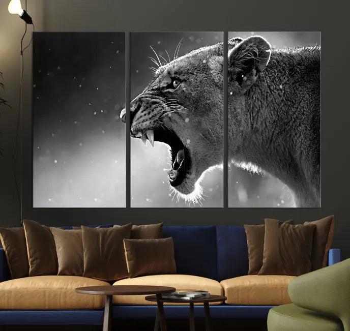 A Lion Wall Art Canvas Print depicting a roaring lioness in black and white, expertly gallery wrapped with UV-protective coating, is displayed in the living room.