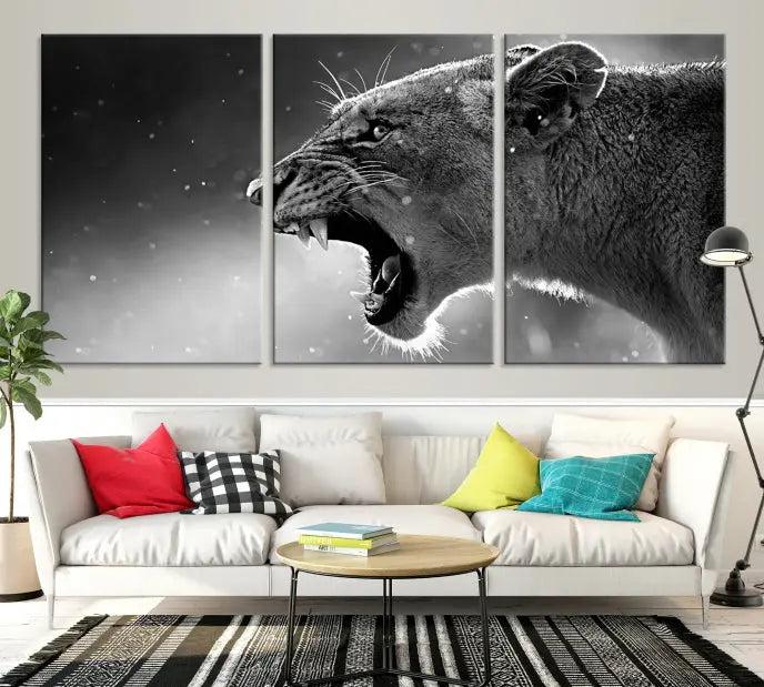 A Lion Wall Art Canvas Print depicting a roaring lioness in black and white, expertly gallery wrapped with UV-protective coating, is displayed in the living room.