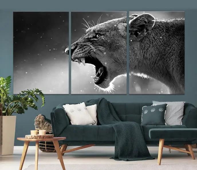 A Lion Wall Art Canvas Print depicting a roaring lioness in black and white, expertly gallery wrapped with UV-protective coating, is displayed in the living room.