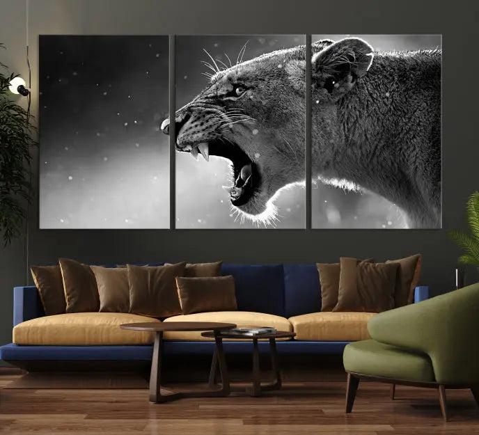 A Lion Wall Art Canvas Print depicting a roaring lioness in black and white, expertly gallery wrapped with UV-protective coating, is displayed in the living room.