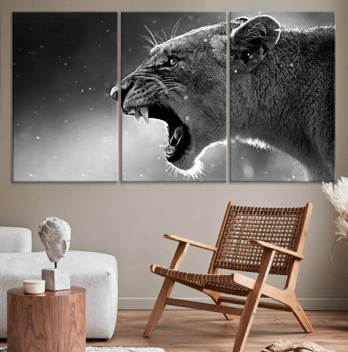 A Lion Wall Art Canvas Print depicting a roaring lioness in black and white, expertly gallery wrapped with UV-protective coating, is displayed in the living room.