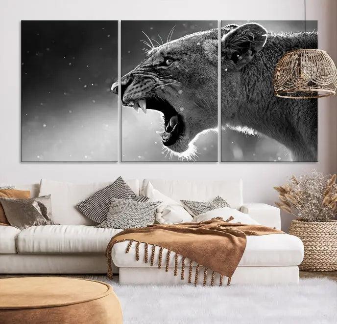 A Lion Wall Art Canvas Print depicting a roaring lioness in black and white, expertly gallery wrapped with UV-protective coating, is displayed in the living room.